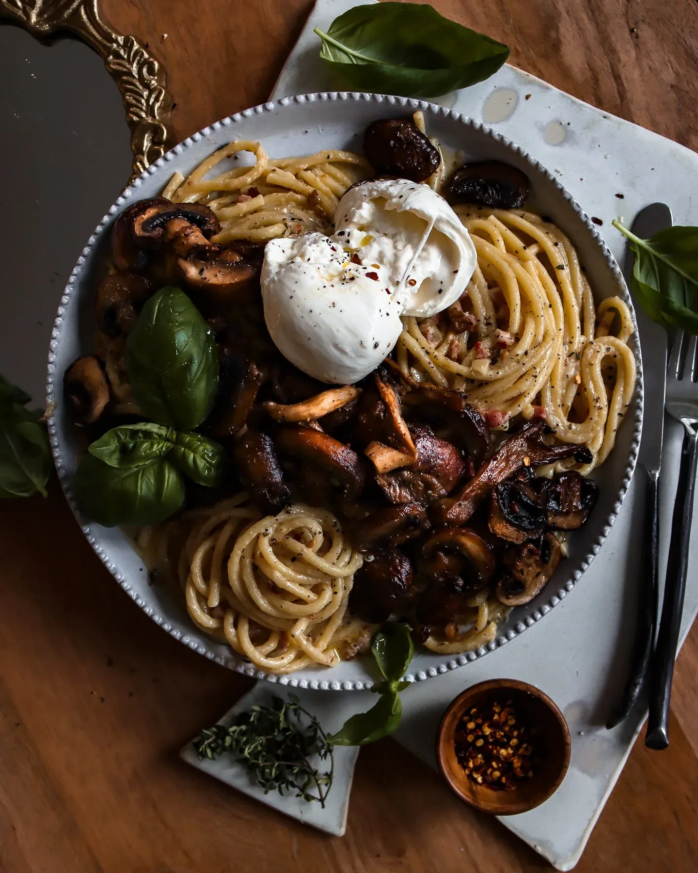 White Wine Pasta with Roasted Mushroom in a large white beaded-rim bowl on a white tray